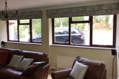 Roman blinds and coordinating piped cushions in Ashley Wilde Elstow collection