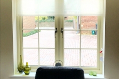 Upholstered window pelmet board in Mistral fabric with voile roller blind