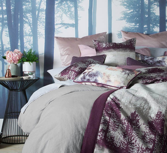 Messy bed with forest background