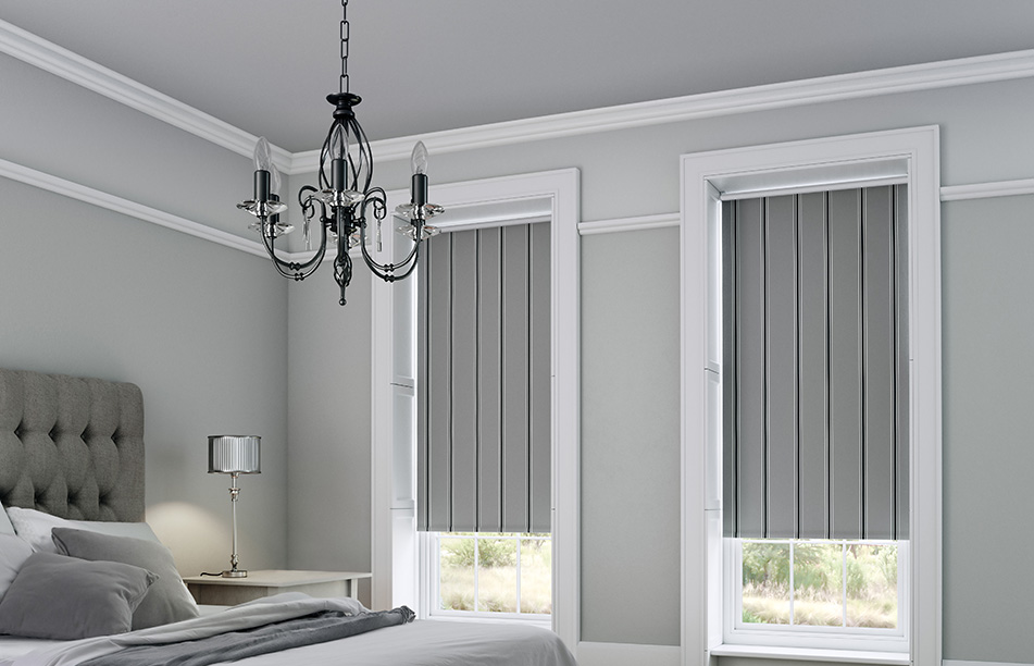Grey roller blinds in a grey bedroom