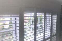 Shaped shutters to arched window Shaped shutters to arched window