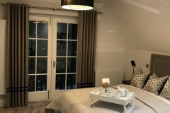 Eyelet curtains with braided trim on Stainless steel pole Eyelet curtains with braided trim on Stainless steel pole