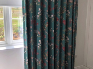 Wave Curtain in Japandi style printed fabric with a rich emerald green background and pink blossom flowers