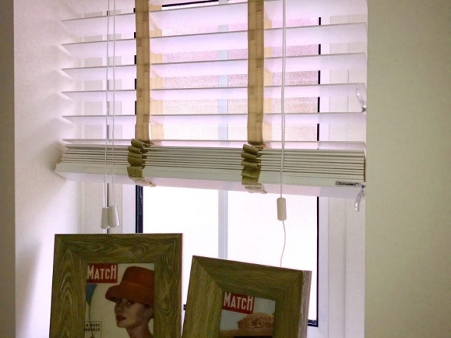 Two picture frames on a window sill