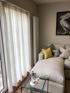 Voile Curtain next to a corner sofa in a living room