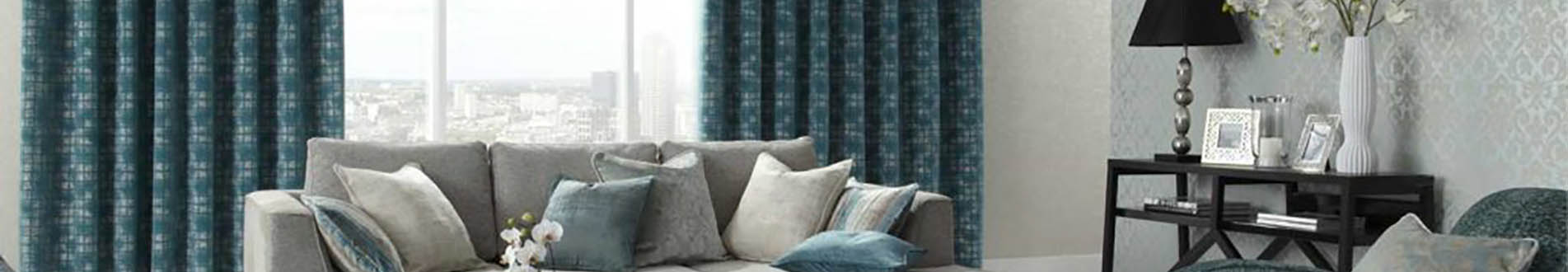 blue curtains and sofa