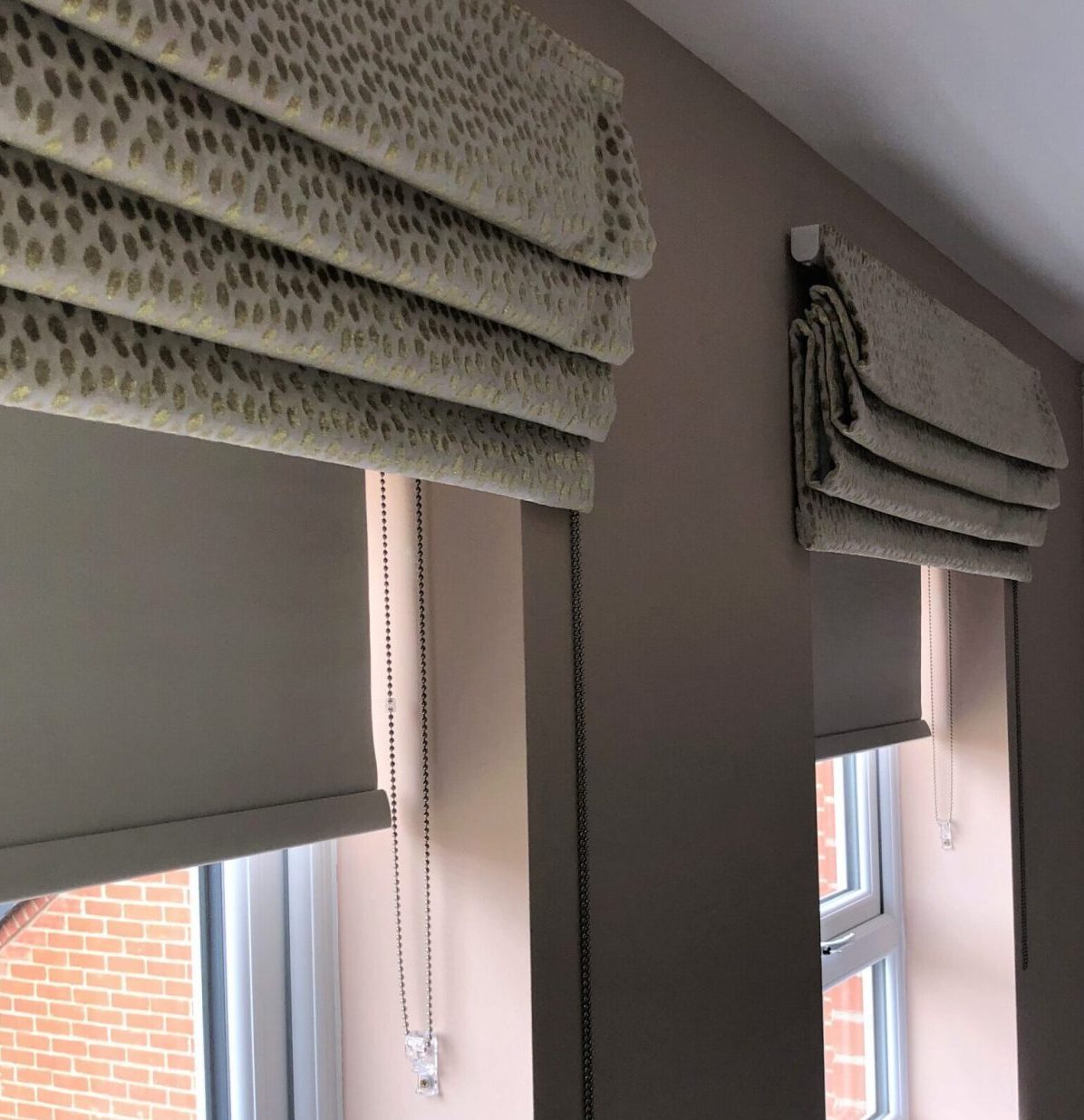 Made to Measure roman blinds with blockout roller blinds installed withing the window recess