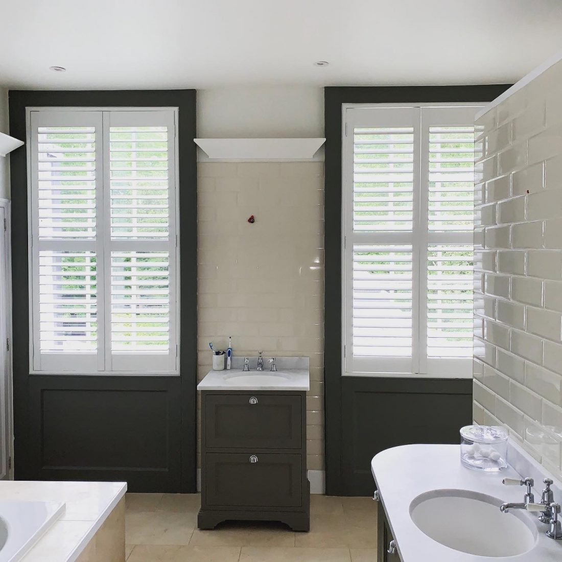 made-to-measure shutters in water resistant solid vinyl installed in a Hertford bathroom