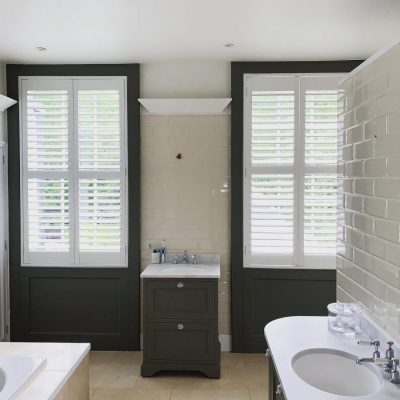 made-to-measure shutters in water resistant solid vinyl installed in a Hertford bathroom