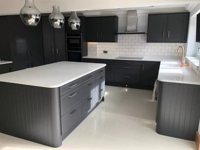 Monochrome Bespoke Kitchen Design. Graphite Kitchen with white metro tiles and copper taps