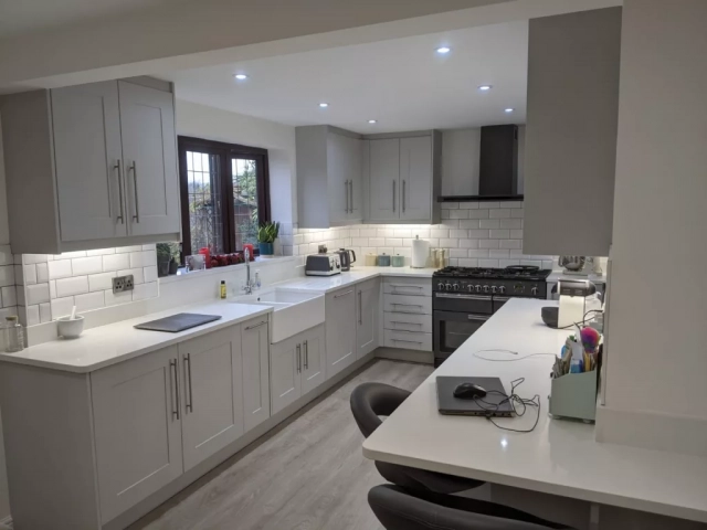 Light Grey Modern Kitchen in super matt light grey with large butler sink and range cooker. Kitchen designed and installed in Harpenden