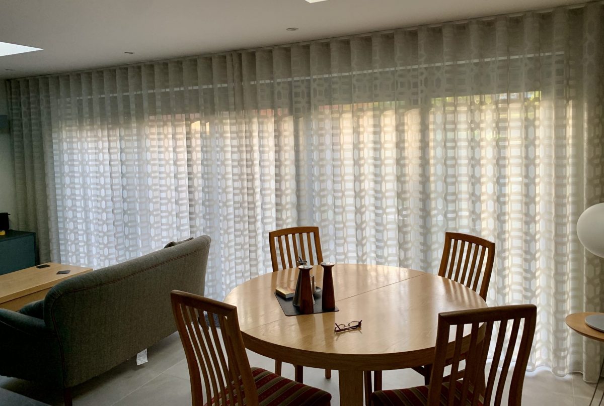 Wave curtains in a textured voile fabric to maximise natural light