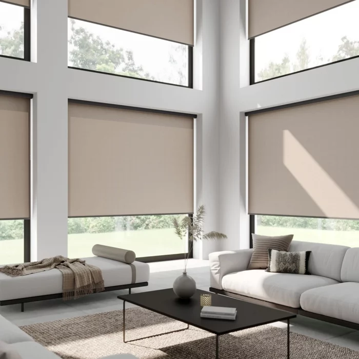 rOLLER BLINDS TO DOUBLE HEIGHT LIVING SPACE IN A tAUPE FABRIC