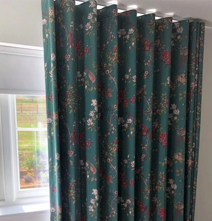 Floor to Ceiling Wave curtains in ILIV Orientalis Fabric with 80mm Wave headings installed in a Harpenden bedroom