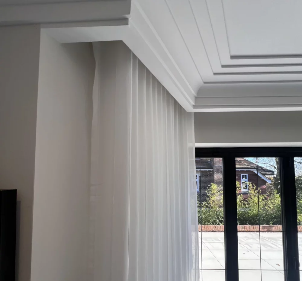 Voile curtains with 80mm Wave heading on a motorised bay curtain track