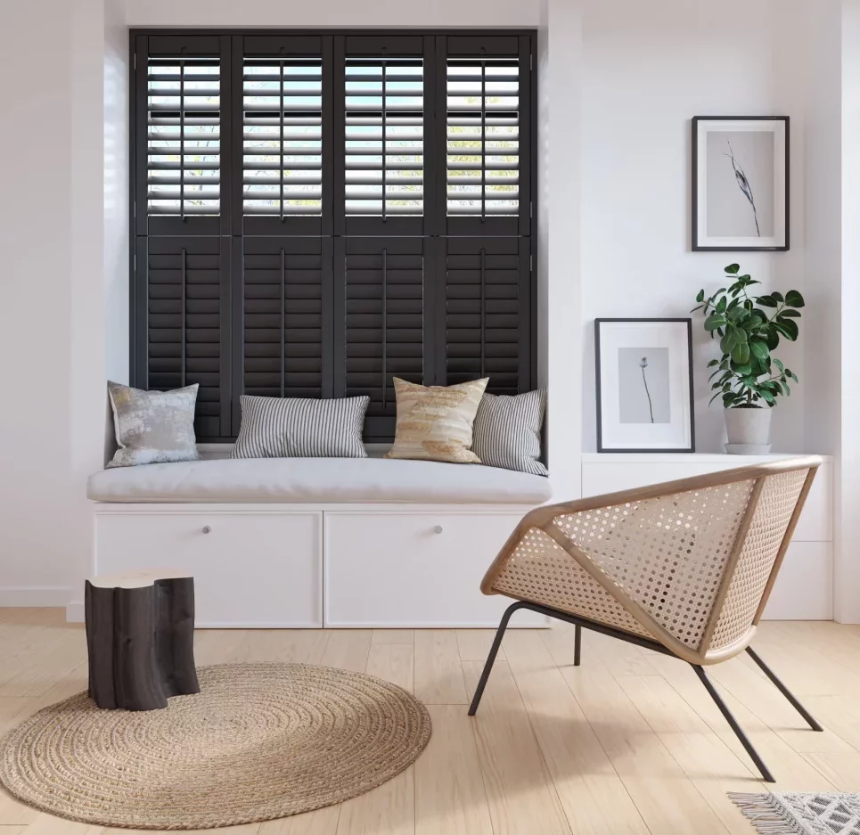 Tier on Tier black painted hardwood plantation shutters installed in a living room