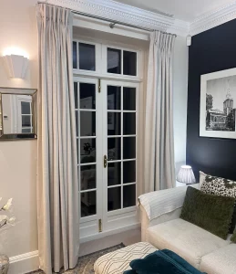 Full-length double pinch pleat curtains in Dakota textured velvet fabric, in colour Fog to complement a monochrome Art Deco style Living Room