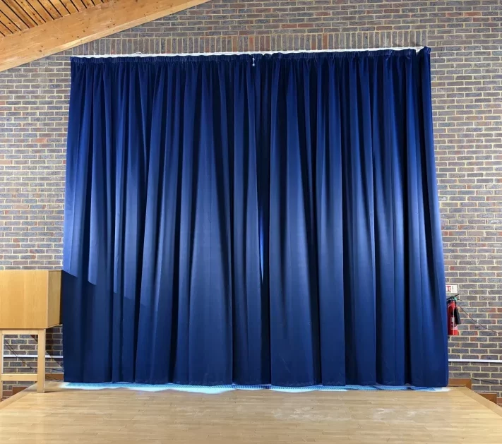 Double height hall curtains in dark blue