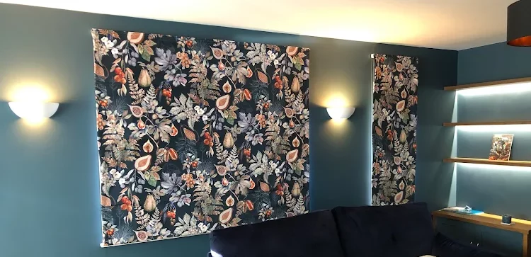 Roman blinds in patterned velvet, installed in a dark blue living room in Welwyn Garden City