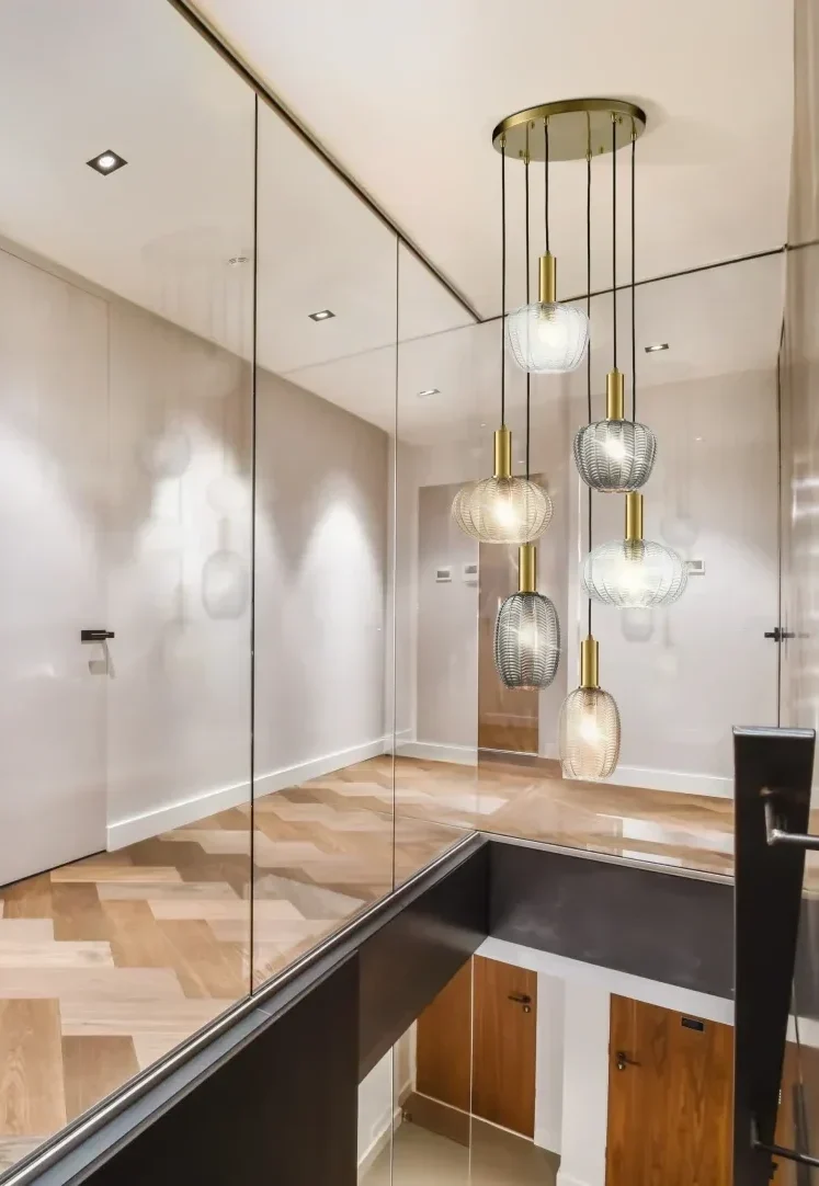 Mezlca pendant lighting, with mix and match brass 6 light spreader and glass shades in varying shape, size and colour